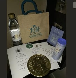A bottle of water among other items in Royal Wedding Gift Bag